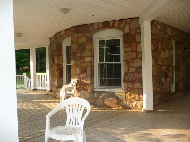 a front view of a house with a large window