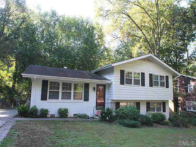 1108 Hardimont Road Raleigh, NC 27609 - Photo 1 of 25 a front view of a house with a yard and potted plants