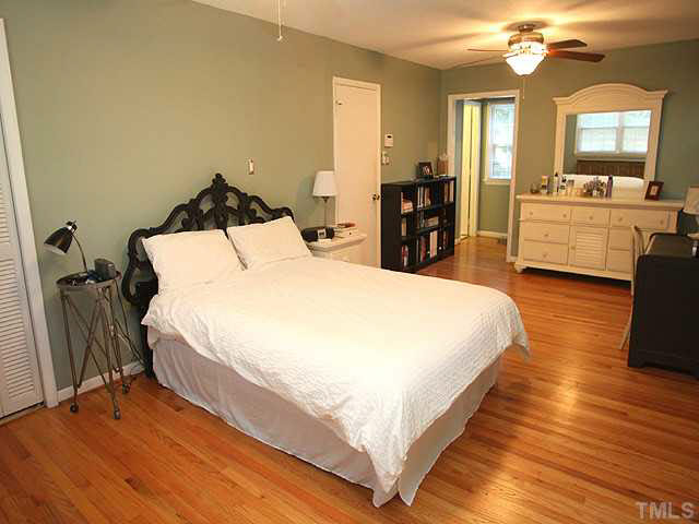 1108 Hardimont Road Raleigh, NC 27609 - Photo 12 of 25 a bed room with a bed and a mirror