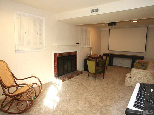 1108 Hardimont Road Raleigh, NC 27609 - Photo 18 of 25 a living room with furniture and a fireplace
