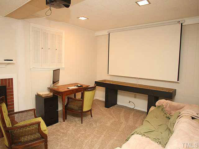 1108 Hardimont Road Raleigh, NC 27609 - Photo 20 of 25 a living room with a couch and a table