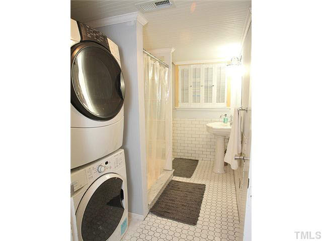 1108 Hardimont Road Raleigh, NC 27609 - Photo 22 of 25 a view of a hallway with washer and dryer