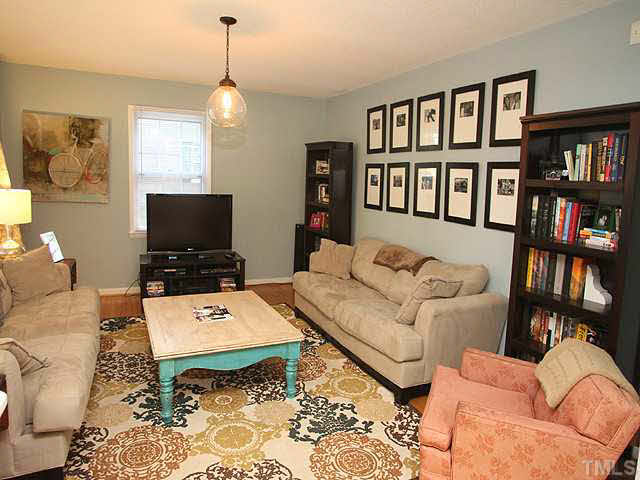 1108 Hardimont Road Raleigh, NC 27609 - Photo 5 of 25 a living room with furniture and a flat screen tv