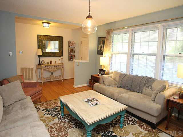 1108 Hardimont Road Raleigh, NC 27609 - Photo 6 of 25 a living room with furniture and a flat screen tv