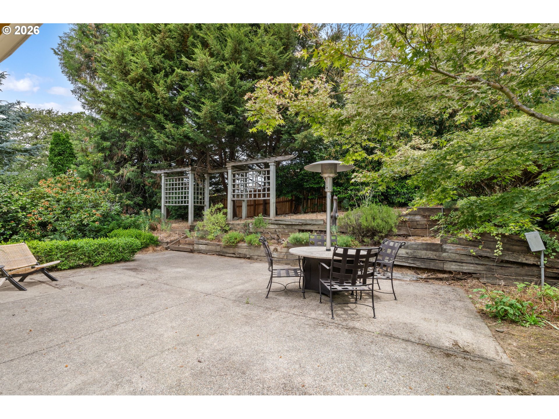 1995 Greiner Street Eugene, OR 97405 - Photo 34 of 39 a view of a patio with table and chairs and potted plants