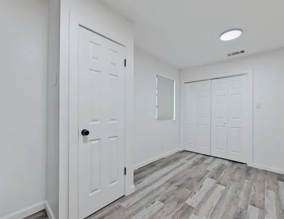 a view of room with hardwood floor