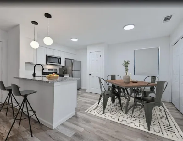a kitchen with sink cabinets and window