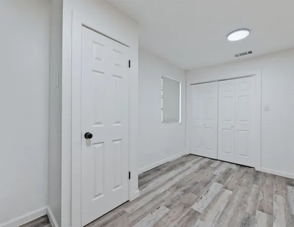 a view of room with hardwood floor