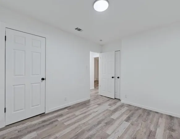 a view of a livingroom with wooden floor