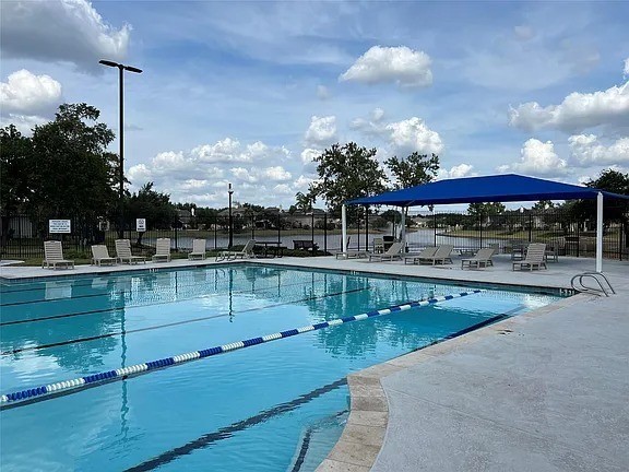 30426 Sunset Falls Drive Spring, TX 77386 - Photo 29 of 30 a view of a swimming pool with a patio