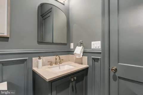 a kitchen with stainless steel appliances granite countertop a sink a stove and cabinets