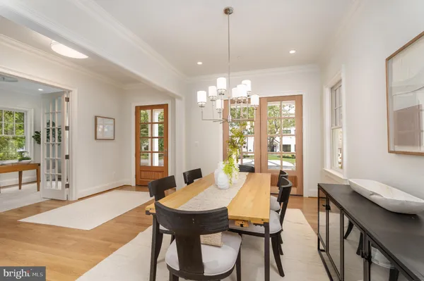 a kitchen with stainless steel appliances a sink a stove and cabinets
