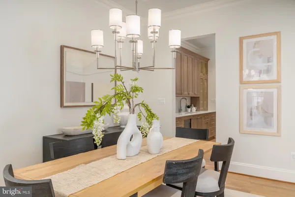 a large white kitchen with a large window