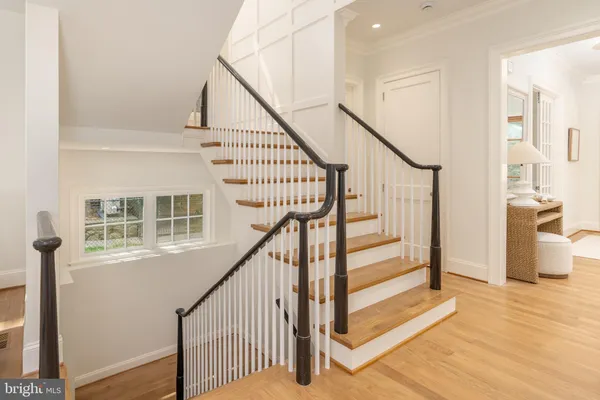 a kitchen with a stove and white cabinets