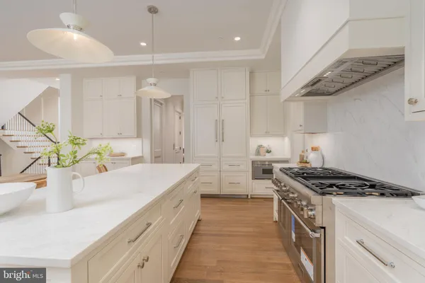a kitchen with a table and chairs in it