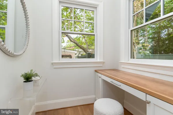 a bedroom with a large bed and a couch