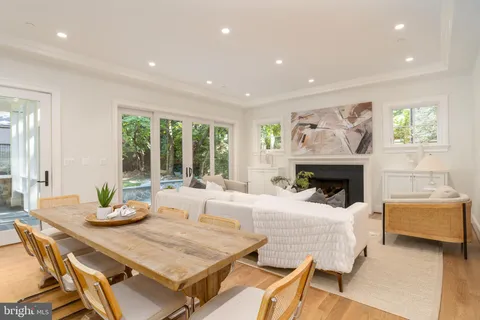 a bathroom with a granite countertop sink and large mirror