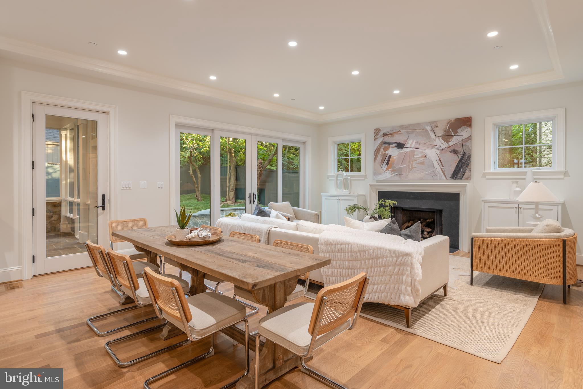 5413 Center Street Chevy Chase, MD 20815 - Photo 33 of 71 a dining room with furniture and a fireplace
