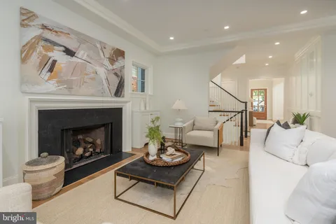 an empty room with closet and entryway