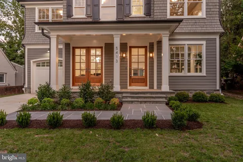 a view of a dining room with furniture and a potted plant
