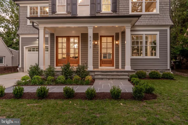 a view of a dining room with furniture and a potted plant