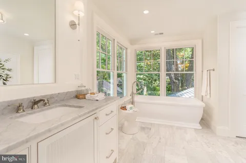 a room with pool table and a flat screen tv