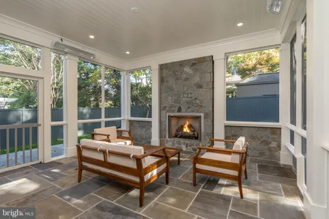 a outdoor living space with patio furniture and a fireplace