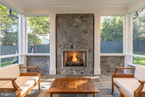 a view of a room that has a window and furniture