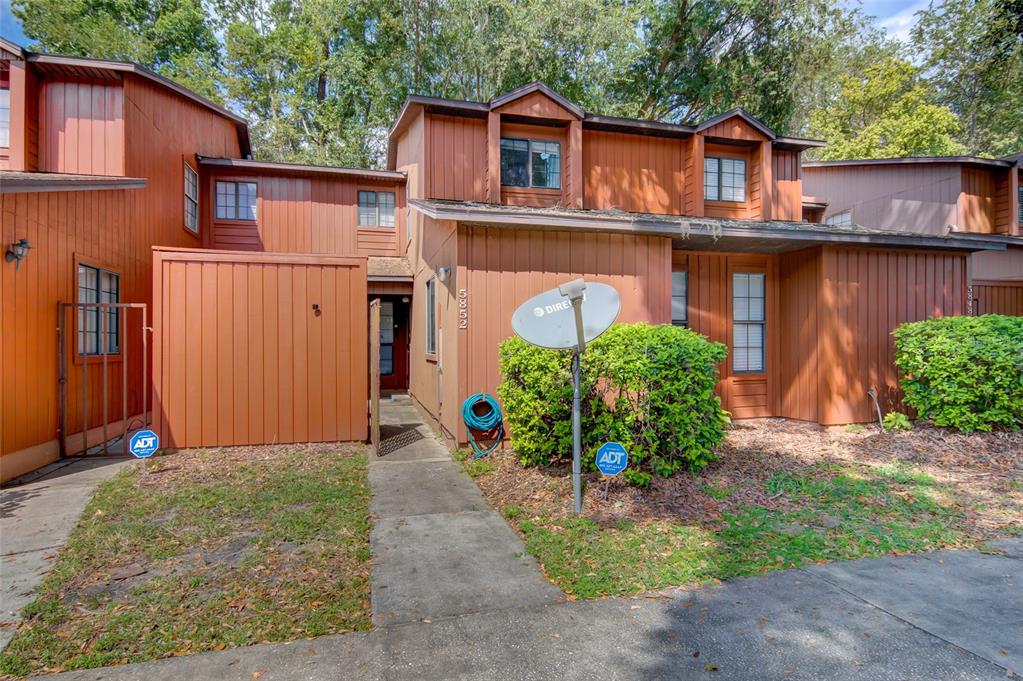 5852 Southwest 8th Place Gainesville, FL 32607 - Photo 1 of 1 a front view of a house with garden