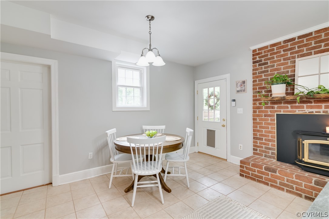 4616 Ladysmith Road Ruther Glen, VA 22546 - Photo 13 of 44 a dining room with furniture a livingroom and chandelier