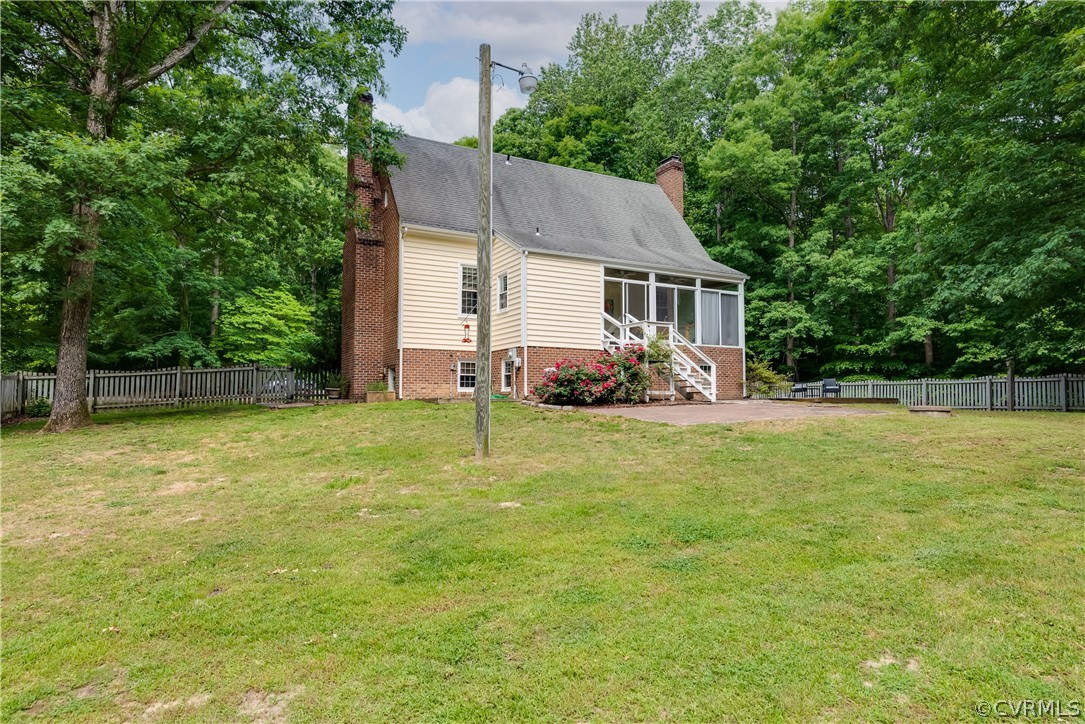 4616 Ladysmith Road Ruther Glen, VA 22546 - Photo 34 of 44 a view of backyard of house with green space