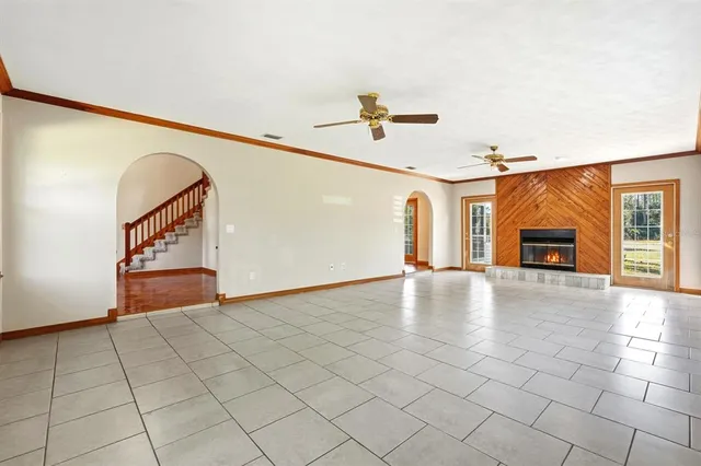 a view of a livingroom with furniture and fireplace