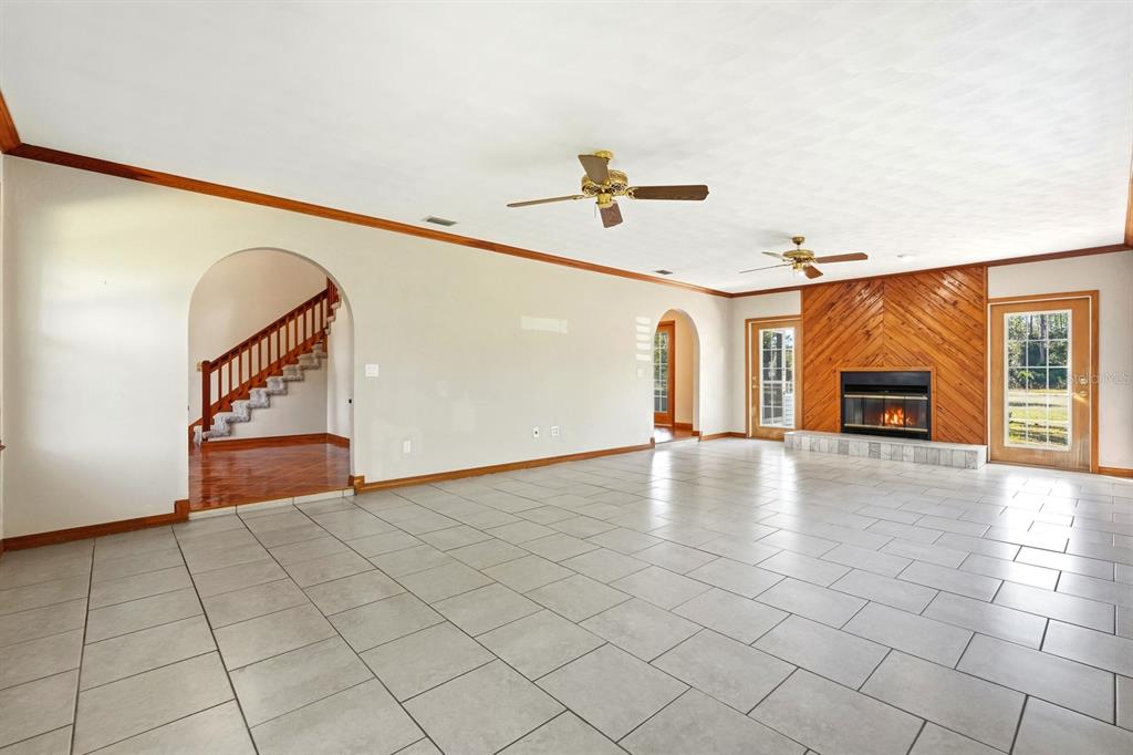 404 Old Haw Creek Road Bunnell, FL 32110 - Photo 15 of 51 a view of a livingroom with furniture and fireplace
