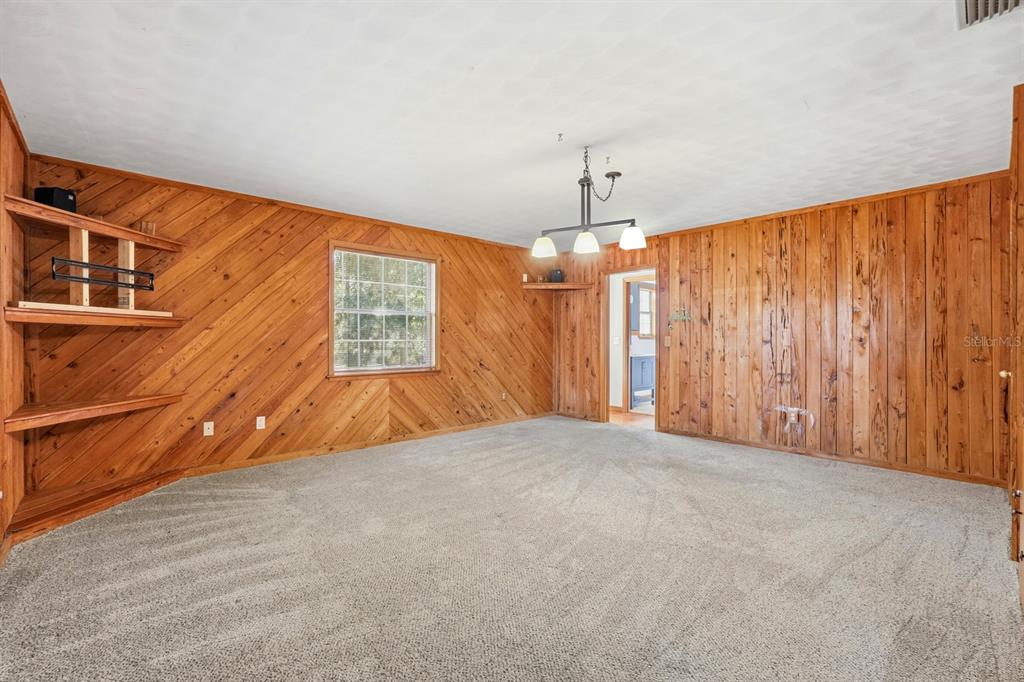 404 Old Haw Creek Road Bunnell, FL 32110 - Photo 18 of 51 a view of an empty room with a window