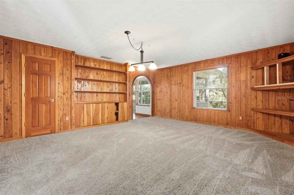 404 Old Haw Creek Road Bunnell, FL 32110 - Photo 19 of 51 a view of a livingroom with an empty space and a window