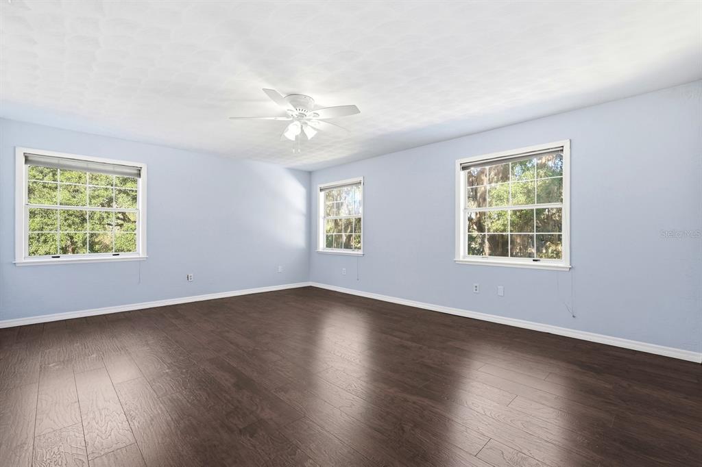 404 Old Haw Creek Road Bunnell, FL 32110 - Photo 22 of 51 a view of an empty room window and wooden floor