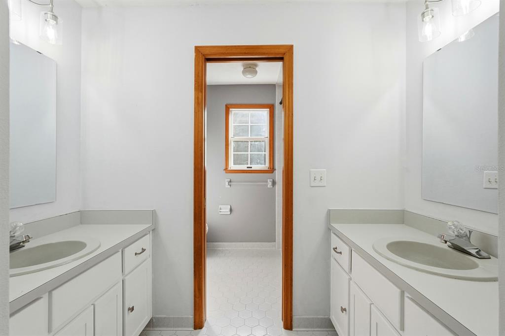 404 Old Haw Creek Road Bunnell, FL 32110 - Photo 30 of 51 a bathroom with a sink and a mirror