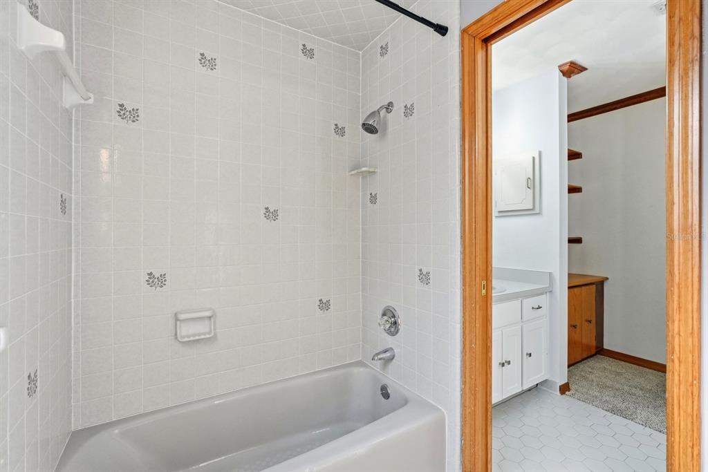 404 Old Haw Creek Road Bunnell, FL 32110 - Photo 31 of 51 a bathroom with a tub shower and sink