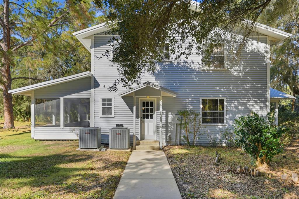 404 Old Haw Creek Road Bunnell, FL 32110 - Photo 36 of 51 front view of a house with a yard
