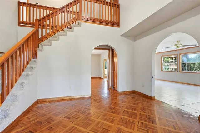 a view of an entryway with wooden floor