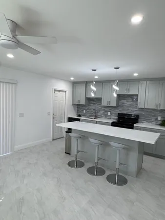 a kitchen with a sink cabinets and counter space