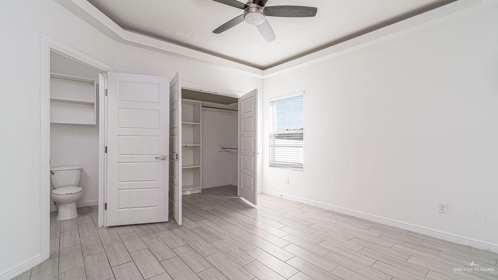 901 East Yuma Avenue, Unit 1902 McAllen, TX 78503 - Photo 10 of 13 wooden floor in an empty room and a bathroom