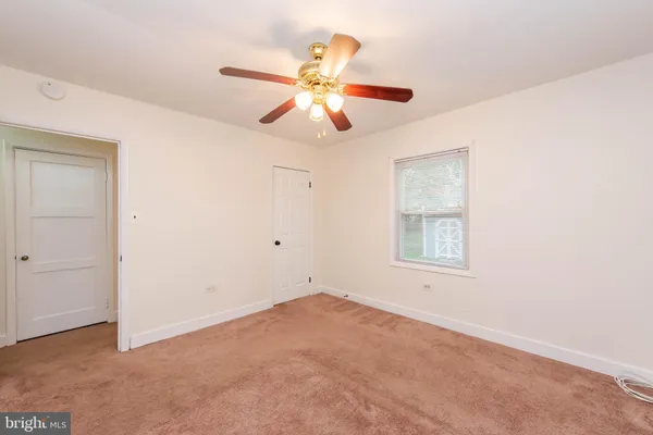 an empty room with a empty space and a window