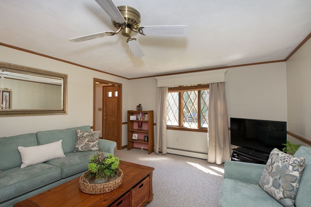 339 School Street Marshfield, MA 02050 - Photo 16 of 40 a living room with furniture and a flat screen tv