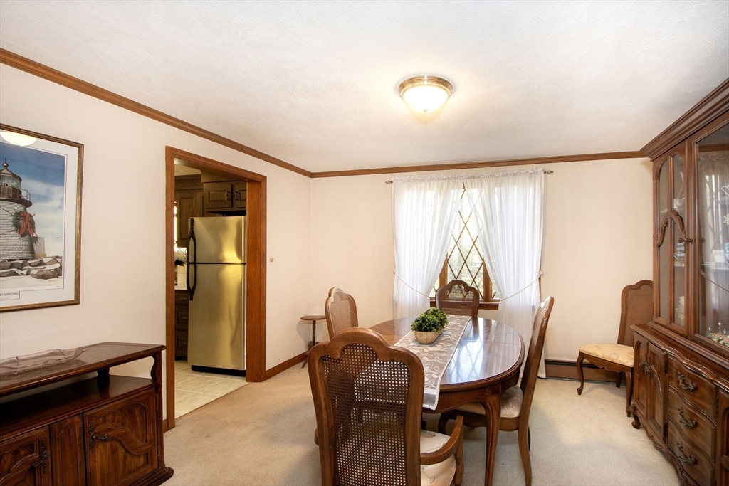 339 School Street Marshfield, MA 02050 - Photo 18 of 40 a view of a dining room with furniture and a window