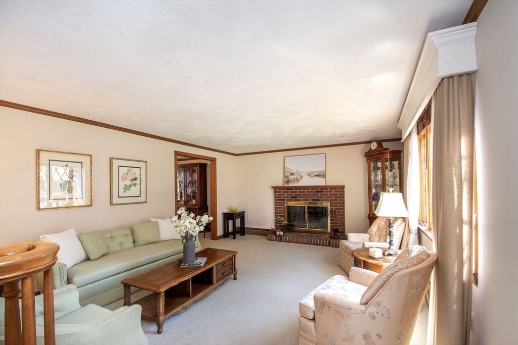 339 School Street Marshfield, MA 02050 - Photo 20 of 40 a living room with furniture large window and a fireplace