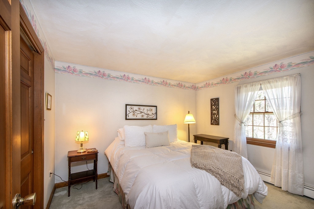 339 School Street Marshfield, MA 02050 - Photo 26 of 40 a bedroom with a bed and a window