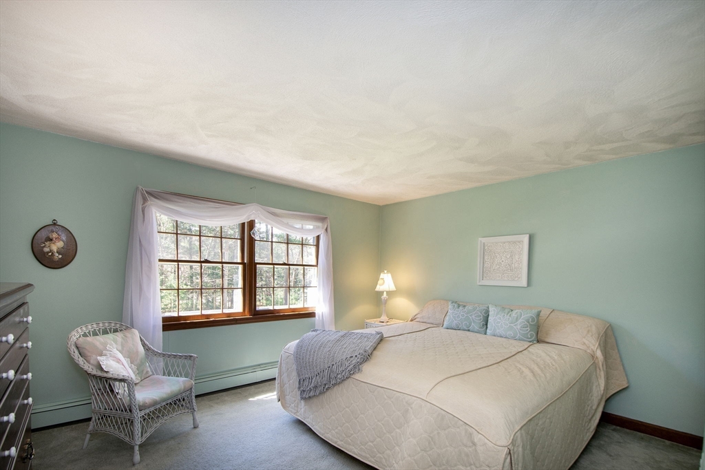 339 School Street Marshfield, MA 02050 - Photo 29 of 40 a bedroom with a bed and a window