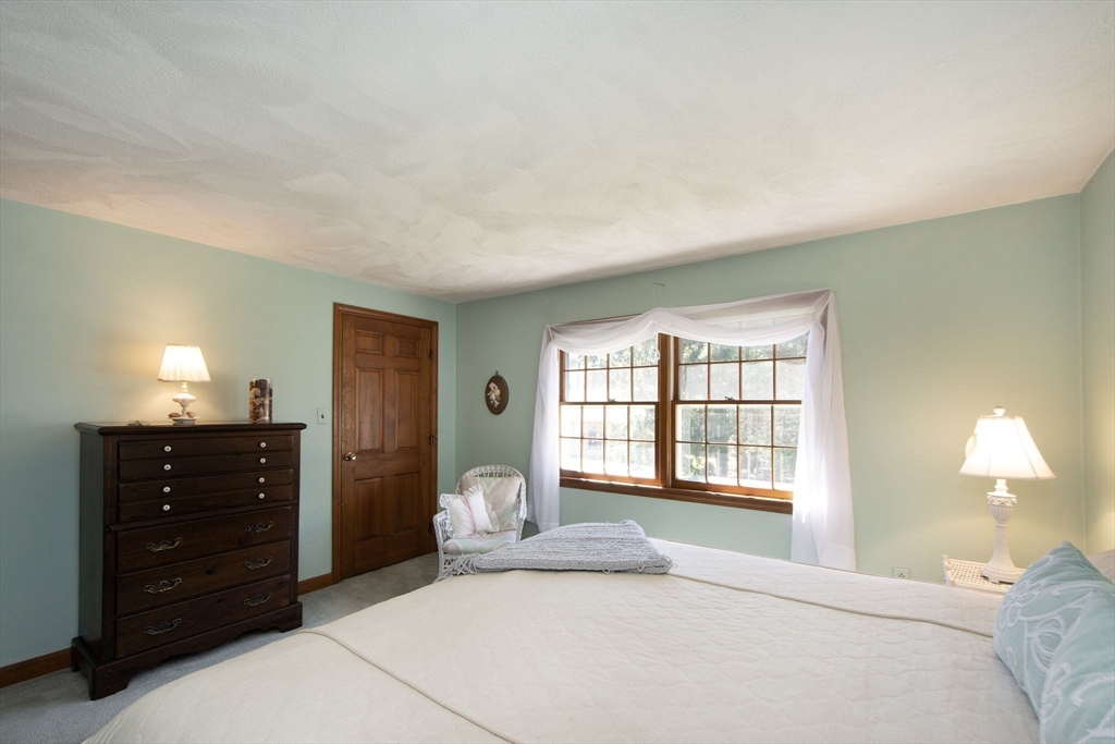 339 School Street Marshfield, MA 02050 - Photo 30 of 40 a bedroom with a bed and a window