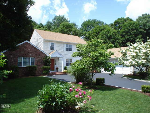 13 Secret Hollow Road Monroe, CT 06468 - Photo 1 of 1 a front view of a house with a yard and fountain